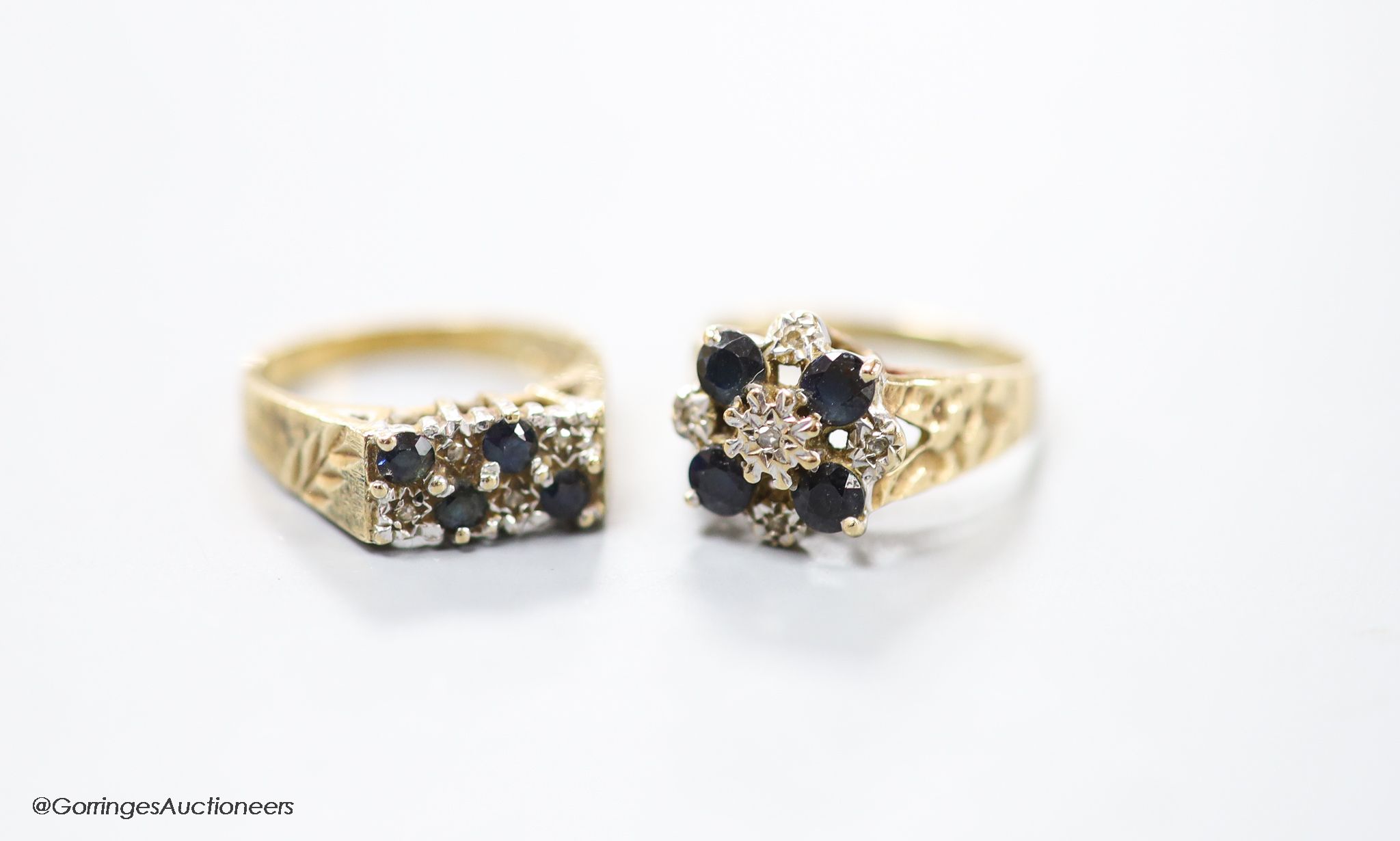 Two modern 9ct gold, sapphire and diamond chip set cluster rings